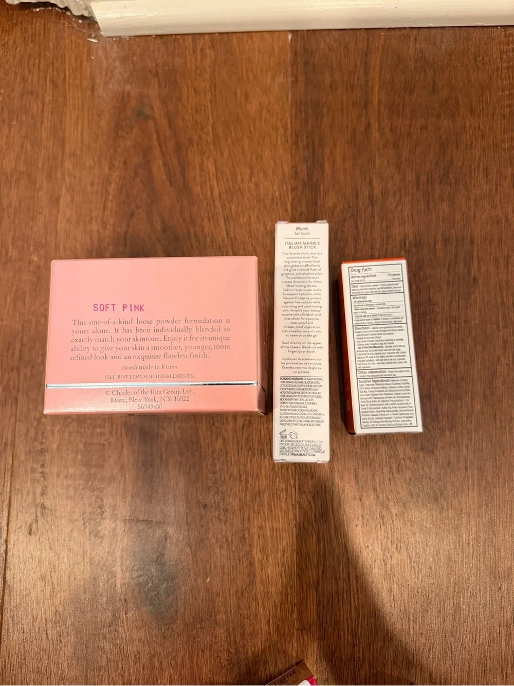 Laura Geller Pink Blush Stick & Lip Serum and charles of the ritz powder